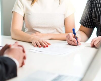 bigstock-Happy-Young-Couple-Signing-Agr-233226352-1024x682-1-480x320